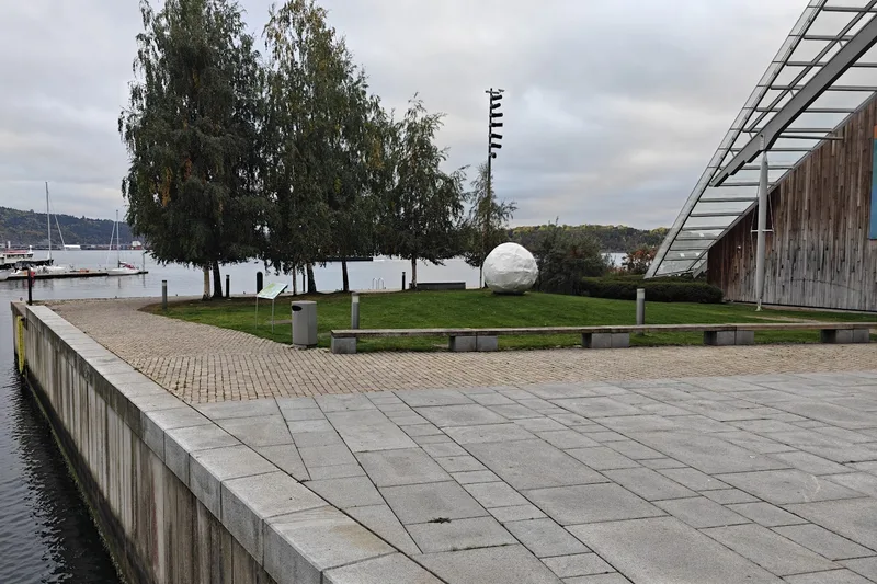 The museum seen from Skjæret, with the lawn, the birch trees and the fjord