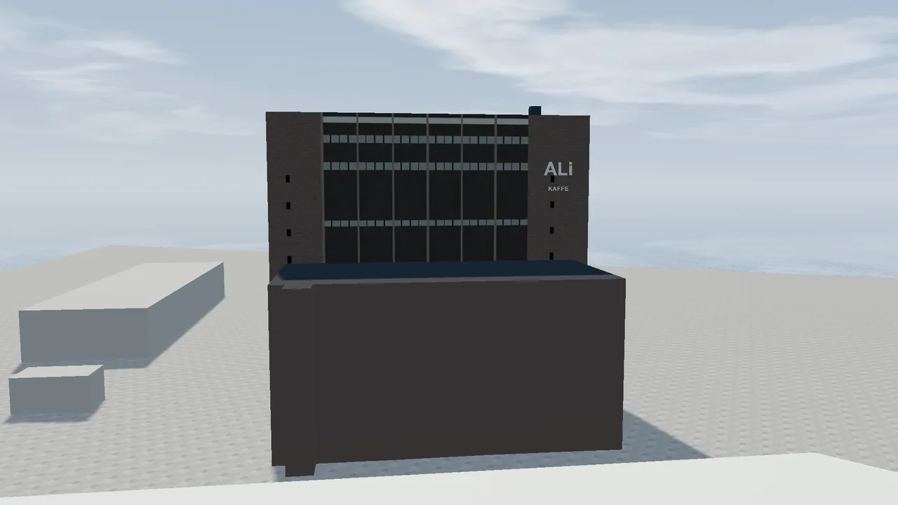 The ALI Building at Filipstad, a tall building in dark brick with the logo ALi KAFFE at the top.