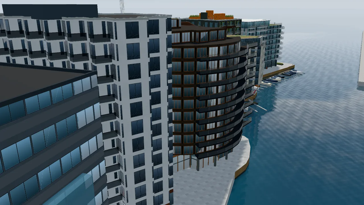 The residential building Kanalen, known as Ovalbygget, with its oval form and copper façade by the water.