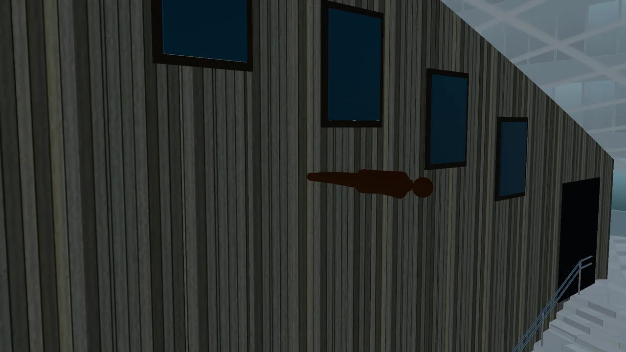 Edge II by Antony Gormley, a human figure sticking out horizontally from the wall above the large staircase.