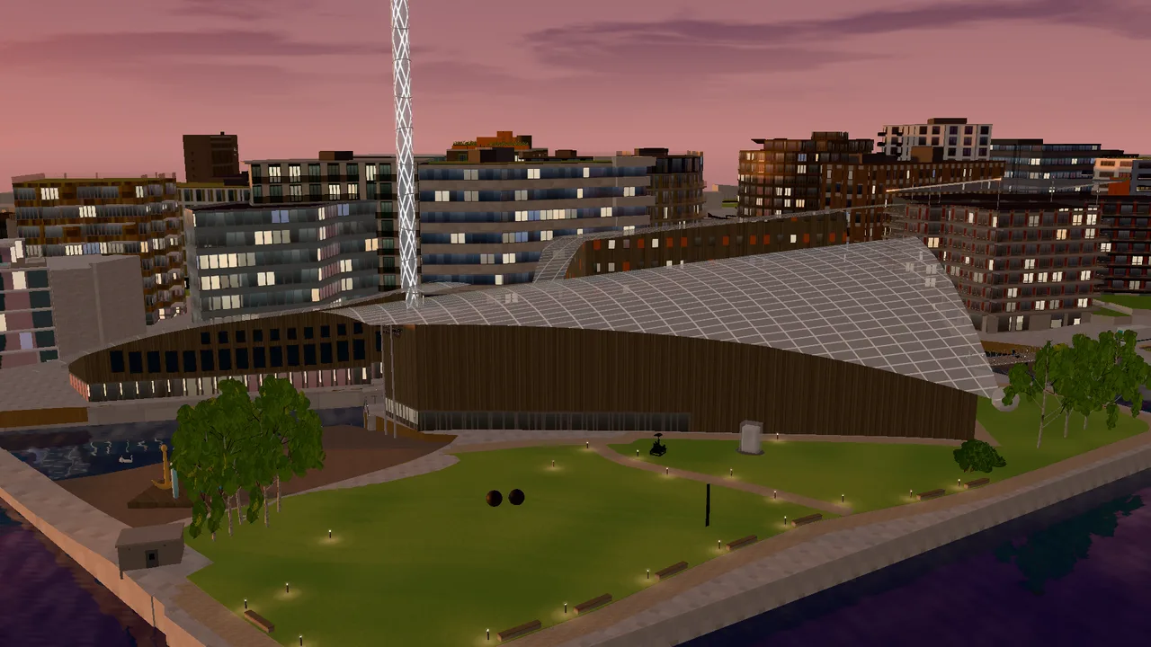 Astrup Fearnley Museet seen from the sea in evening light, with its sail-shaped glass roofs.
