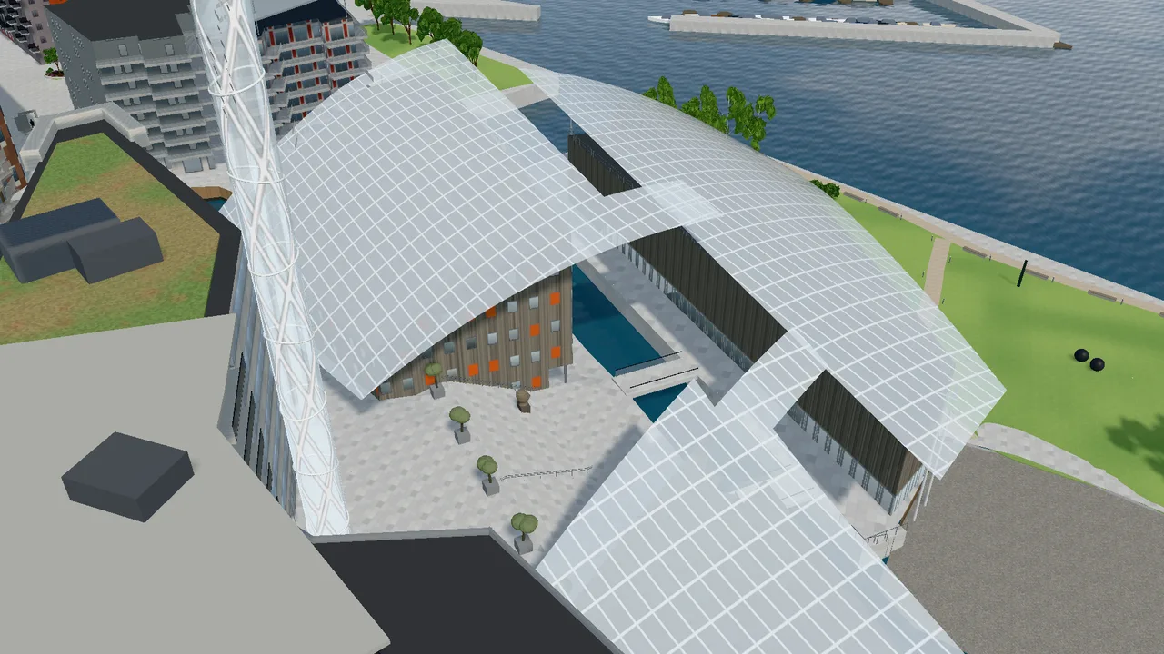 The glass roofs of Astrup Fearnley Museet seen from above, with the canal between the buildings.