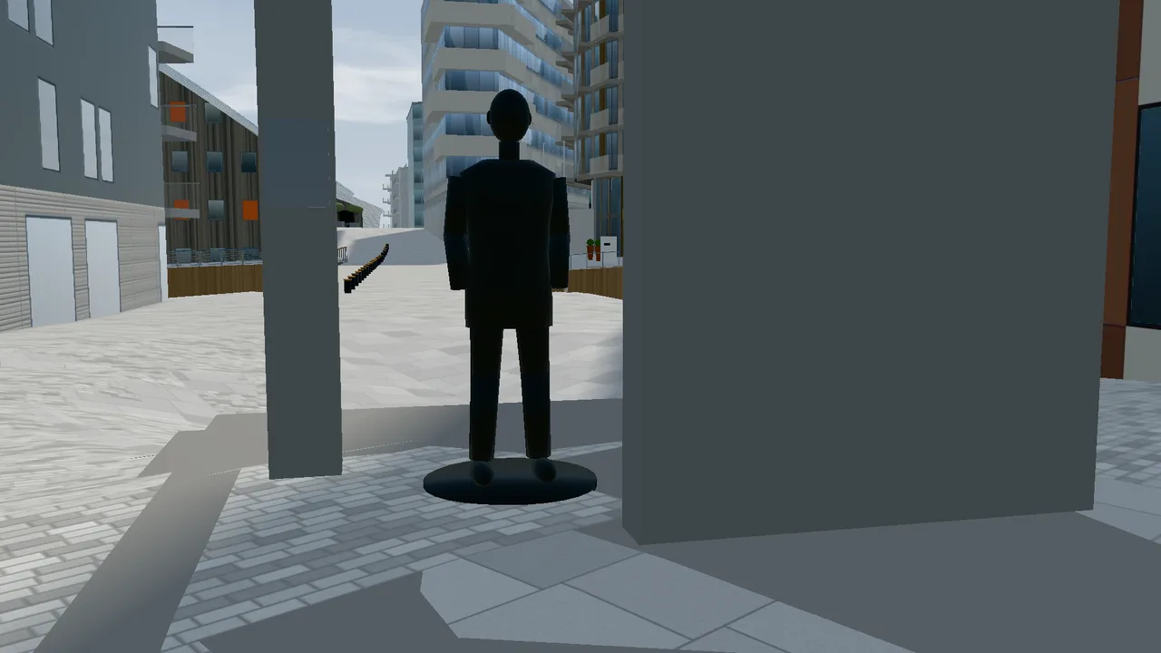 The statue of Olav Selvaag in front of a concrete portal on Olav Selvaags plass.