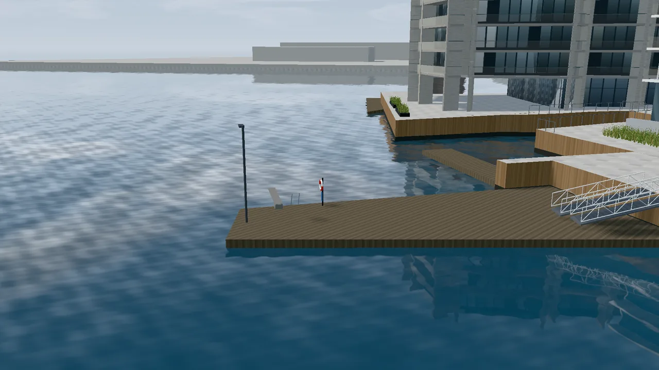 The bathing jetty at the far end of Tjuvholmen with a diving board, lifebuoy and gangways.
