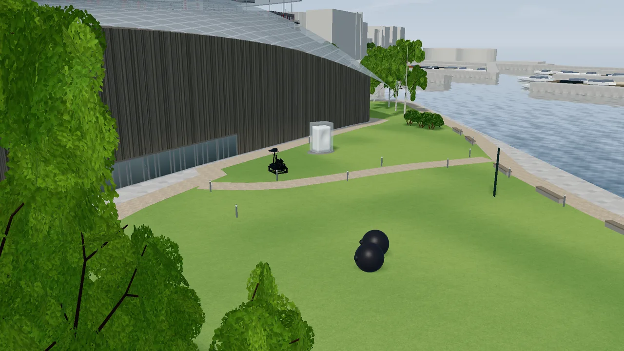 The sculpture park on Tjuvholmen with lawns, paths and sculptures in front of the museum.