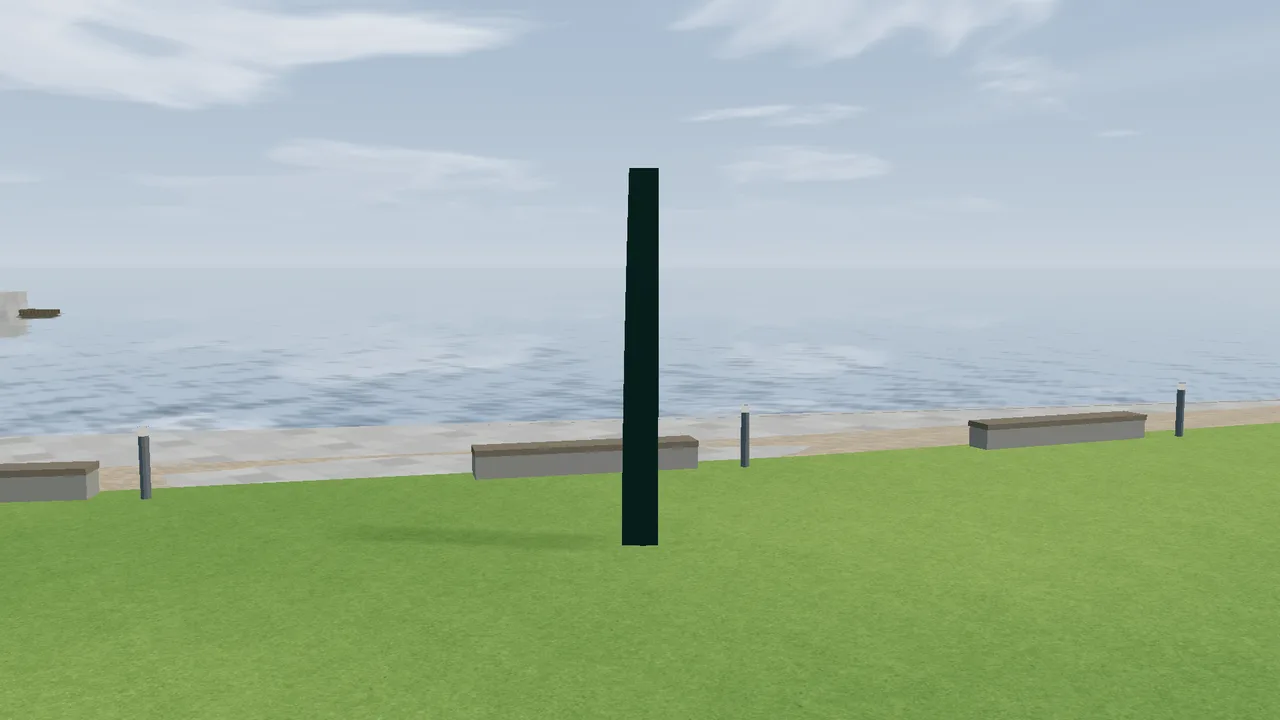 Untitled (Totem) by Ellsworth Kelly, a tall, narrow bronze plate on the grass by the fjord.